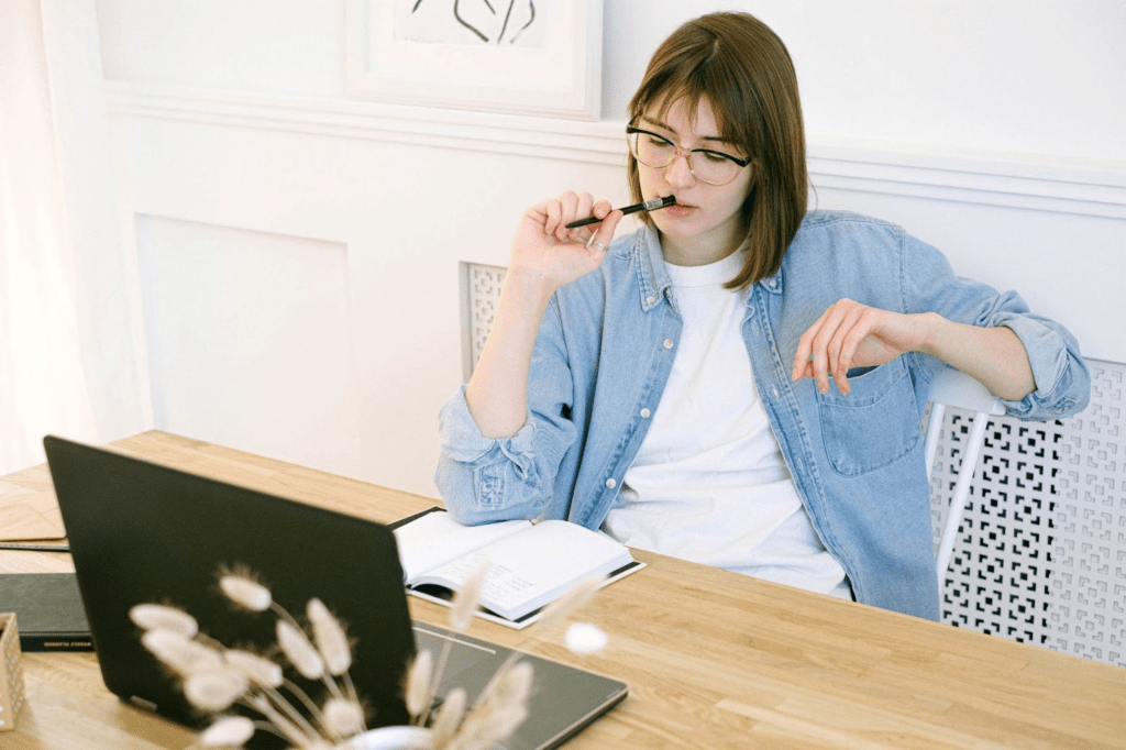 A woman in front of a laptop